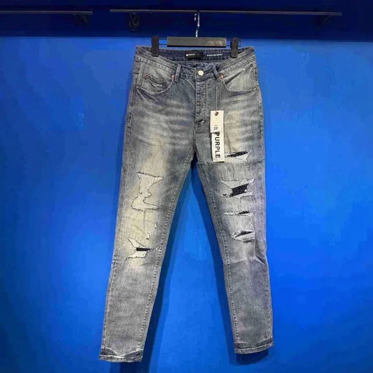 Foreign trade new real-shot spot beauty trendy high street casual ripped hole slim fit men and women couples washed denim trousers with slight flares