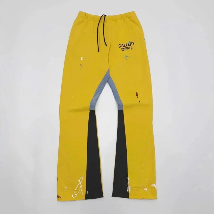 Dept. trousers legs are spliced with multi-colored black letters and white waves