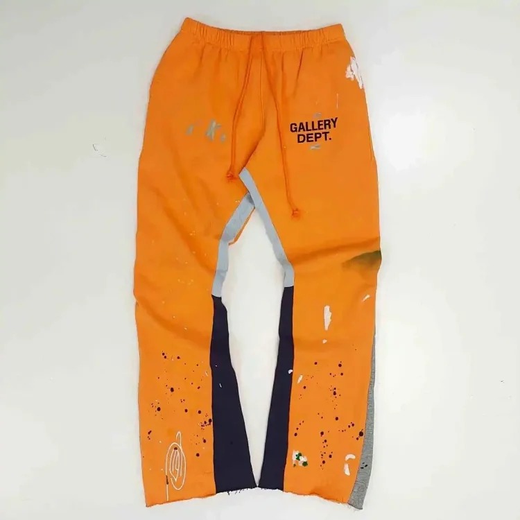 Dept. trousers legs are spliced with multi-colored black letters and white waves