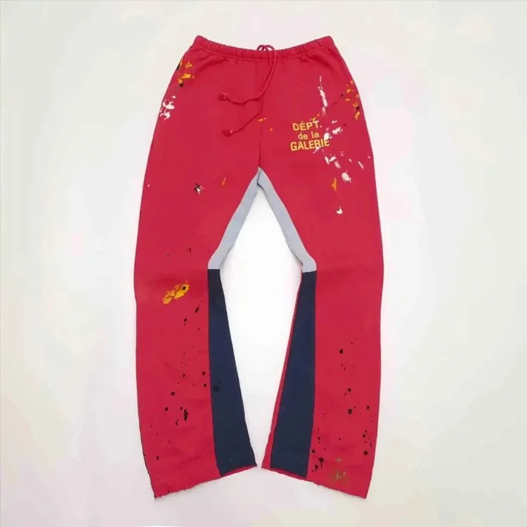 Dept. trousers legs are spliced with multi-colored black letters and white waves