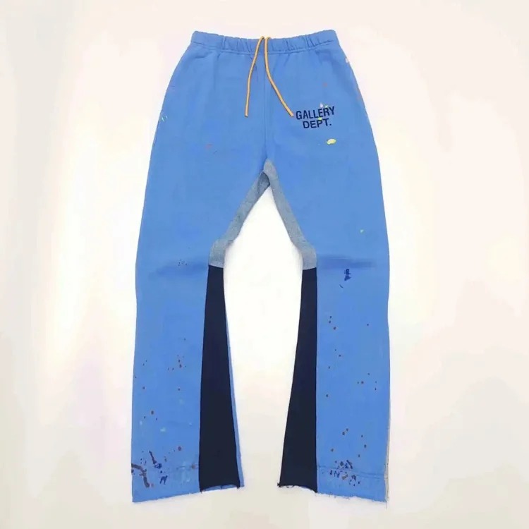 Dept. trousers legs are spliced with multi-colored black letters and white waves