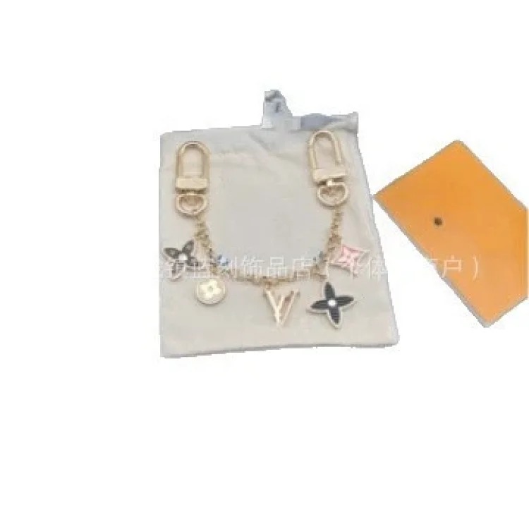 Louis Vuitton Fashionable multi-flower light luxury old flower four-leaf clover alloy sunflower keychain bag pendant decoration chain