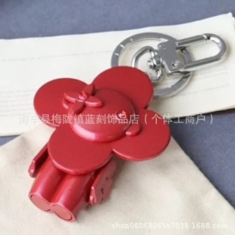 Sunflower high-end niche European and American retro metal doll four-leaf clover backpack accessories bag pendant keychain