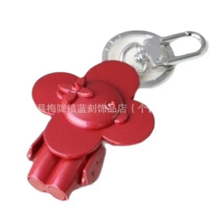 Sunflower high-end niche European and American retro metal doll four-leaf clover backpack accessories bag pendant keychain