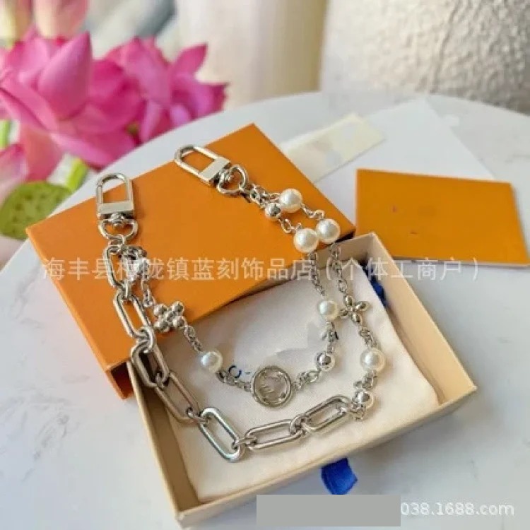 Letter jewelry bag hanging wholesale keychain pendant bag chain trendy brand titanium steel bag chain dropshipping