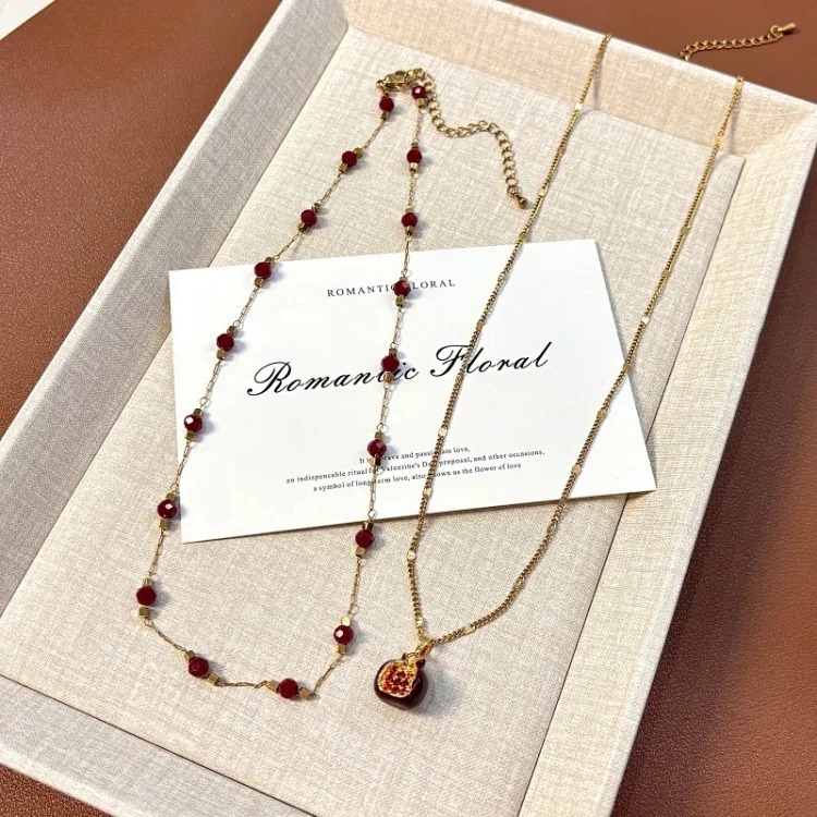 Red oil-dropping pomegranate pendant double-layer stacked necklace for women, niche design, light luxury, high-end sweater chain