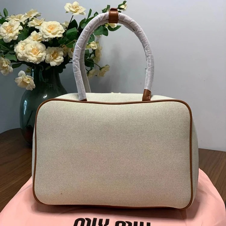 Miu 2024 new bowling briefcase large capacity portable shoulder crossbody bag fashionable commuter women's bag trend