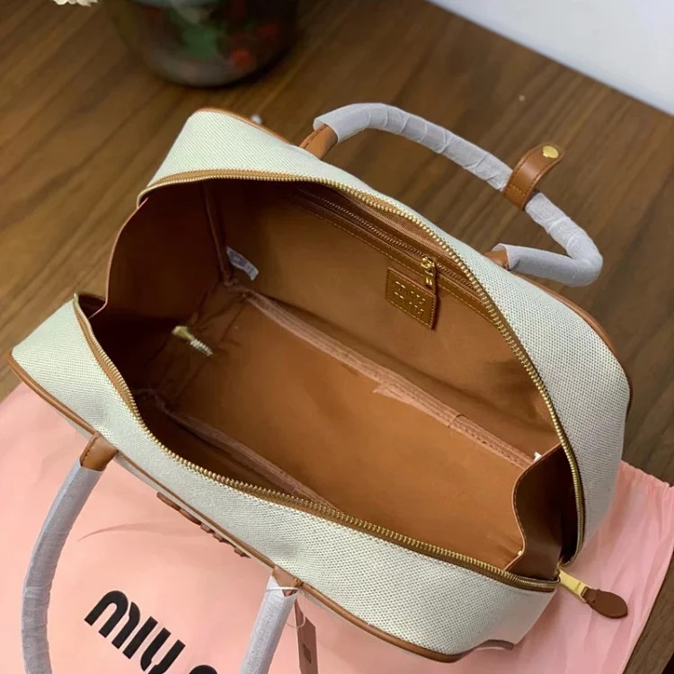 Miu 2024 new bowling briefcase large capacity portable shoulder crossbody bag fashionable commuter women's bag trend