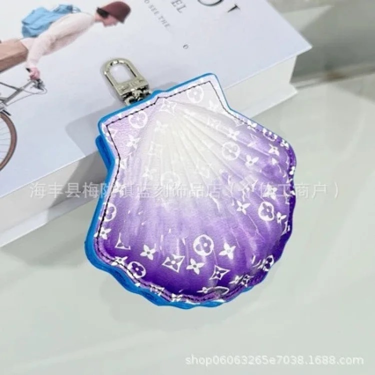 Cross-border Vivian keychain handmade genuine leather sunflower bag pendant four-leaf clover metal doll pendant