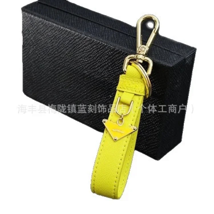 Pujia's new triangle logo keychain light luxury leather multi-color metal simple home pendant dropshipping