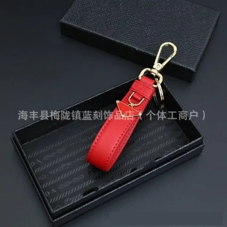 Pujia's new triangle logo keychain light luxury leather multi-color metal simple home pendant dropshipping
