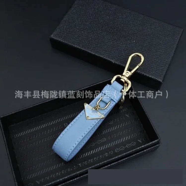 Pujia's new triangle logo keychain light luxury leather multi-color metal simple home pendant dropshipping