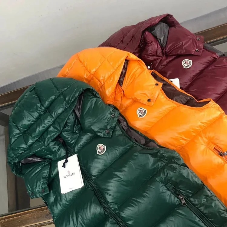 Good quality moncle couple's hooded down vest.