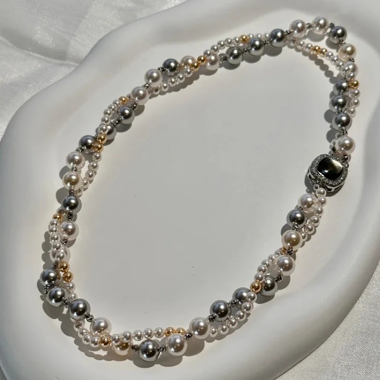 A two-stacked double-layered pearl necklace for women, light luxury and high-end mixed-color niche versatile autumn and winter sweater chain decoration