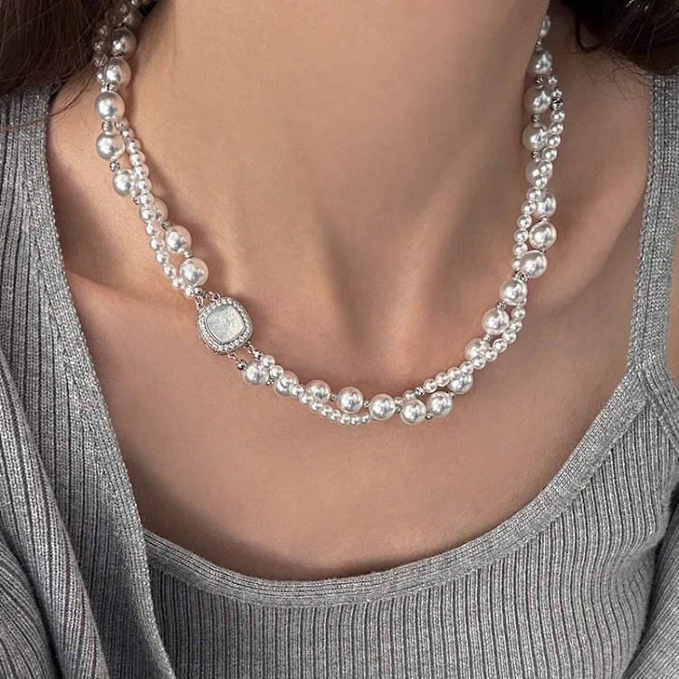 A two-stacked double-layered pearl necklace for women, light luxury and high-end mixed-color niche versatile autumn and winter sweater chain decoration
